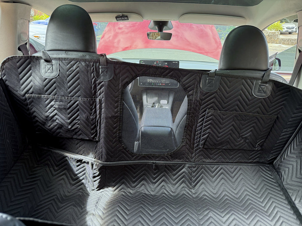 Interior view of dog backseat extender with mesh window and storage pockets